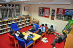 Some year 6 boys enjoying a good, cosy read while the snow falls outside.